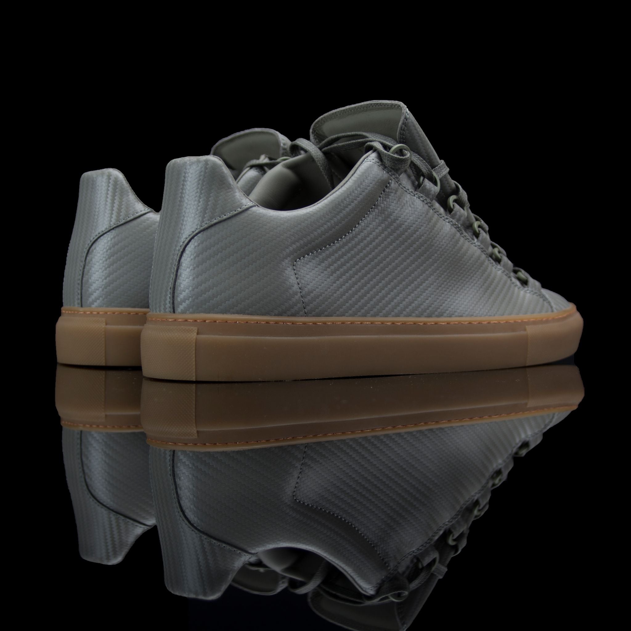 Balenciaga-Arena-Product Code: Colour: Khaki Carbon Fibre - Gum Sole Discontinued Material: Leather, Rubber Sole BALENCIAGA, the Paris based label drops the Arena Low. The casual sneakers are composed in Khaki Carbon Fibre Leather and Gum Sole. Also, the