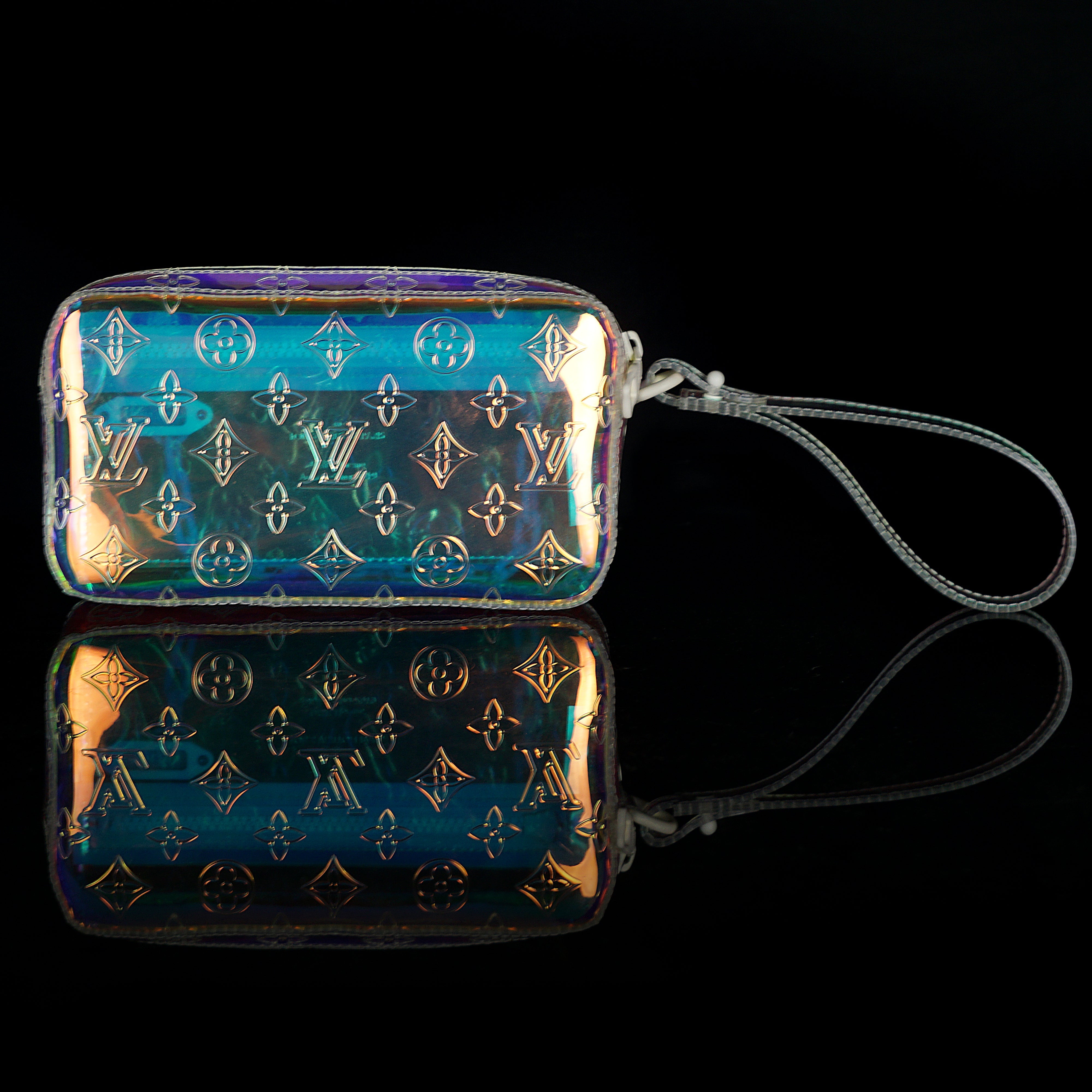 Louis Vuitton-Clutch-23.0 x 11.5 x 4.0 cm (Length x height x width ) L 8.4 x H 4.7 x W 1.9 inches Highly resistant PVC Highly resistant PVC and calf-leather trim Mat-white hardware Zipped compartment Zipped front pocket Removable strap-fabriqe.com