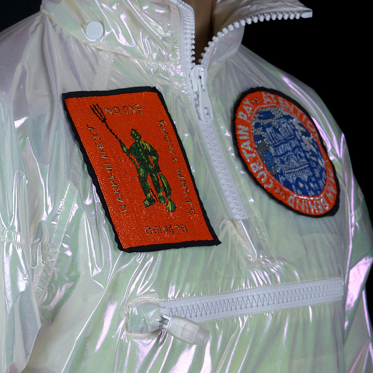 Louis Vuitton-Windbreaker-Colour: Iridescent Style: Windbreaker Material: Transparent Iridescent PVC Virgil Abloh SS19 exclusive pop up item Zipper front Back LV large logo Beaded patches Zippers along front Drawstring bottom Made in Italy-fabriqe.com